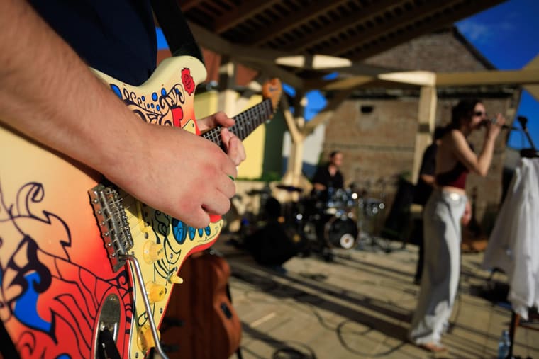 The guitarist mid-solo on stage