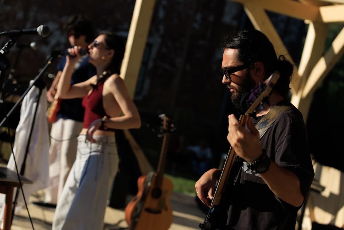 Three members of Moongroove playing together mid-set